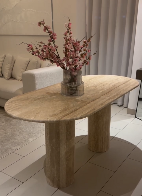 Rounded based travertine dining table